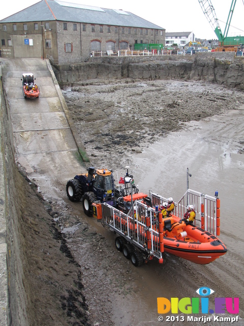 SX26448 Big and small lifeboat tracktors going up slipway